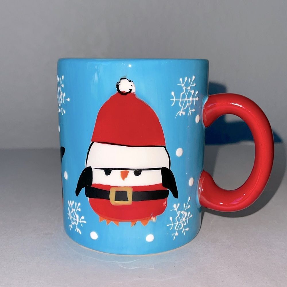 Pier 1 Penguin in Santa Outfit Blue Coffee Mug.